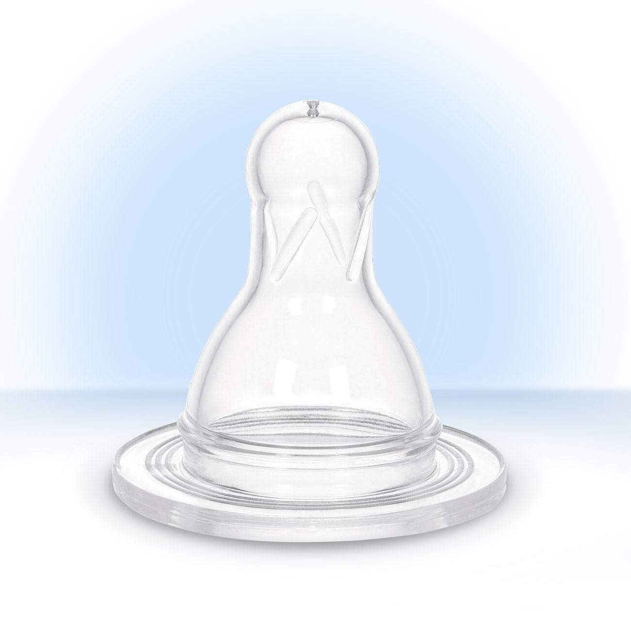 a glass vase sitting on top of a white table 