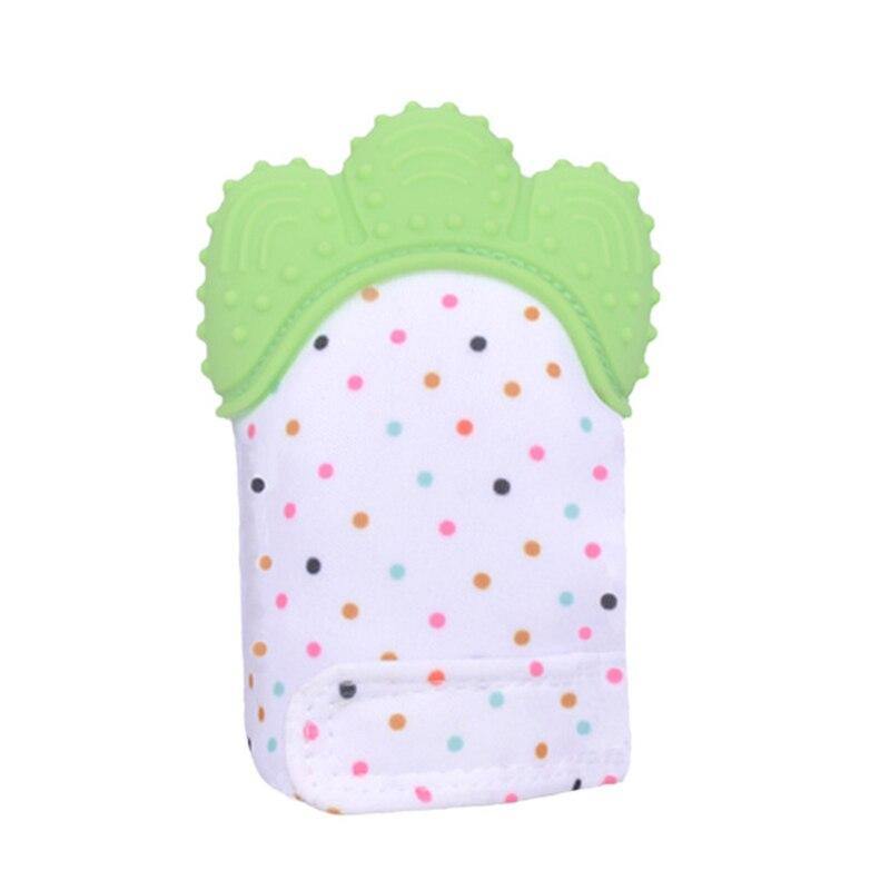 a doll is wearing a green and white hat