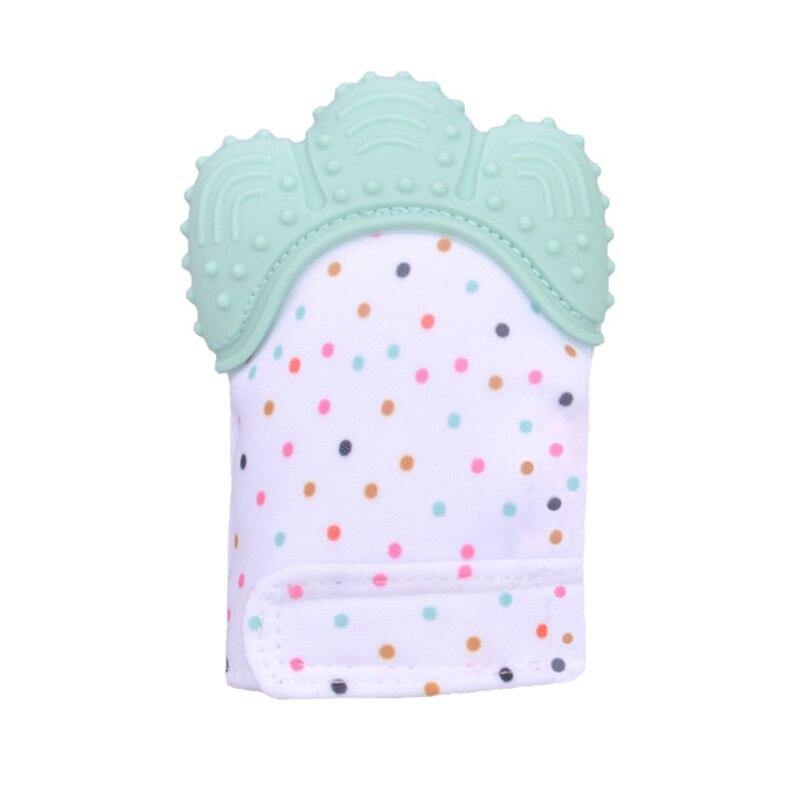 a small crocheted hat on a piece of cloth