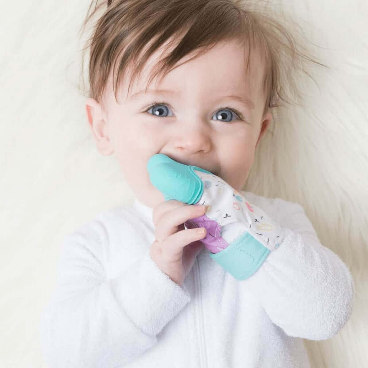 a young boy is brushing his teeth with a toothbrush